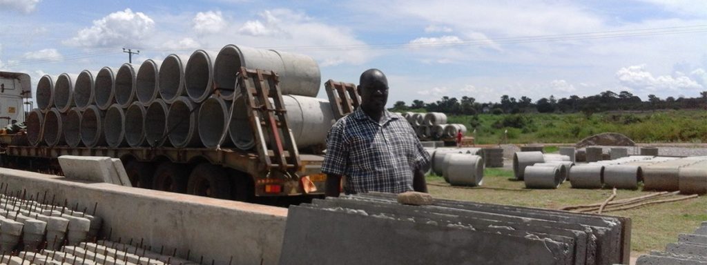 Concrete culvert pipes loaded on a truck for delivery from the Sanqua yard in Soroti