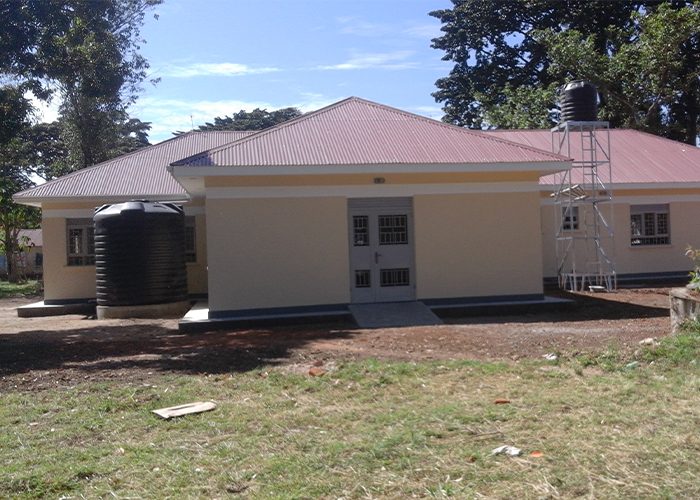 Completed school building with a red roof